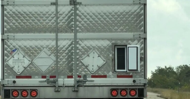 The Real Reason Truck Trailers Have That Small Door On The Back